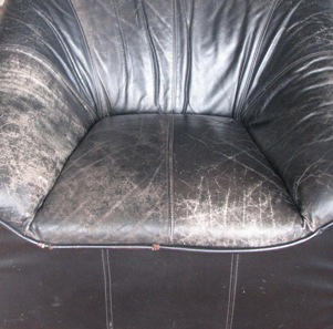 worn black leather chair