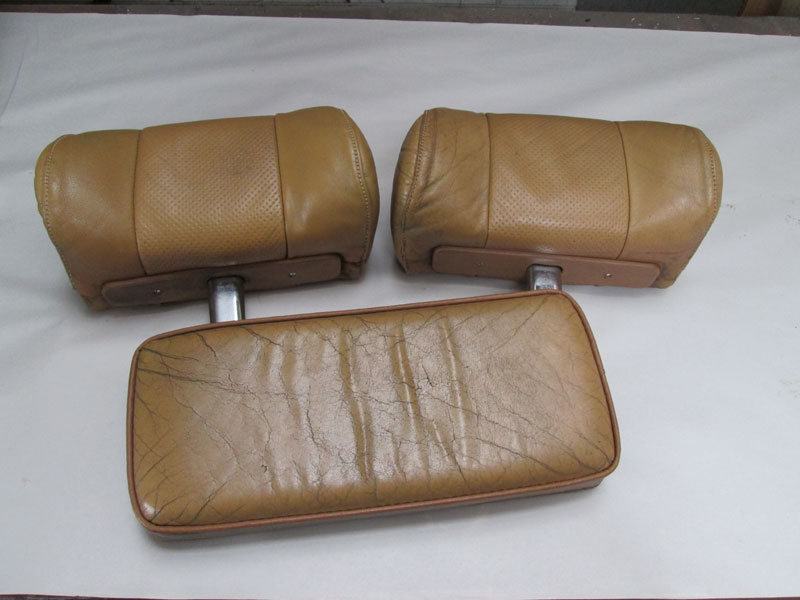 leather headrests and console lid before restoration 
