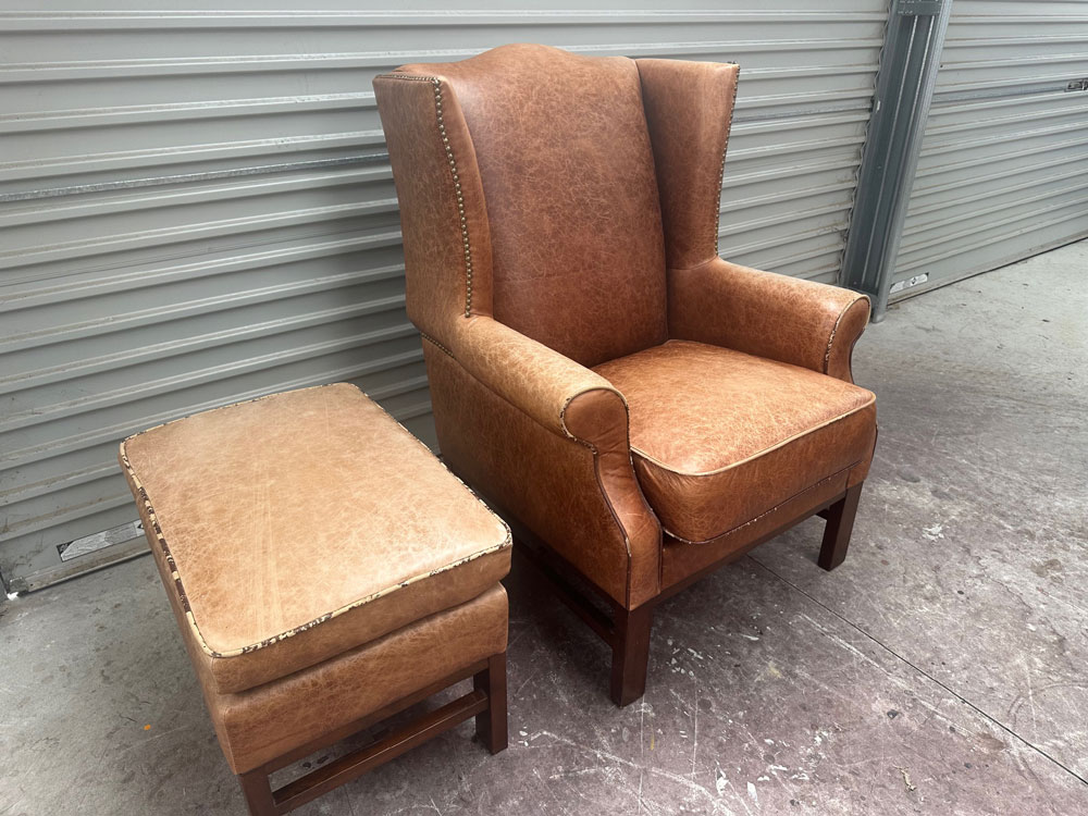 Faded leather chair and footstool