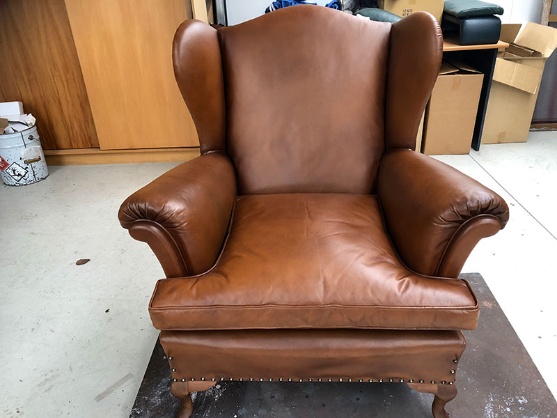 Wing-back leather chair restored