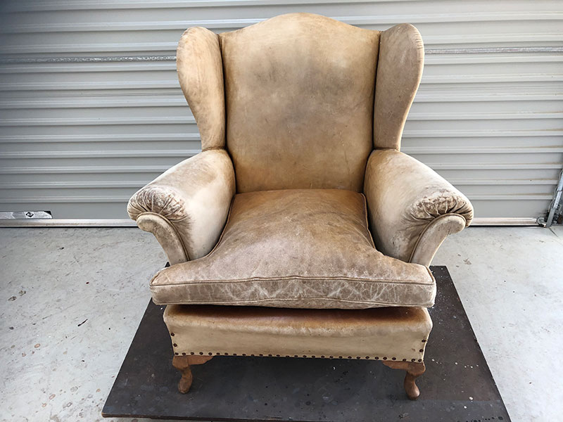 Old wing-back leather chair